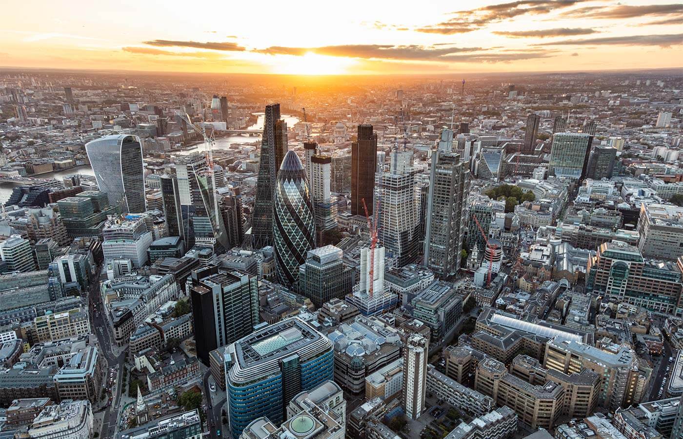 Aerial view of the London audit and financial offices at sunset.